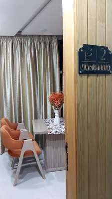 a room with a table and a chair and a table and a vase at Studio Marzouga in Deroua