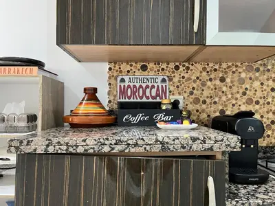 a counter top with a sign on it in a kitchen at Central Studio Casablanca in Casablanca