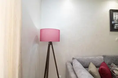 a lamp in a living room next to a couch at Mamounia Horizon in Casablanca