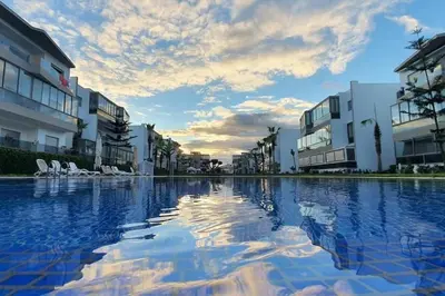 a large pool of water in front of some buildings at Appartement Blanca Beach in Sidi Rahal