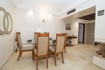 a dining room with a table and chairs at Anfa Dream in Casablanca
