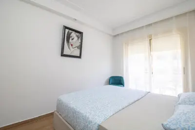 a bedroom with a bed and a picture on the wall at Anfa Dream in Casablanca