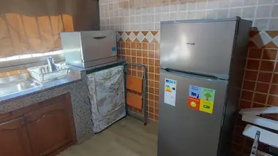 a kitchen with a refrigerator and a sink at Appartement moderne centre Casablanca in Casablanca