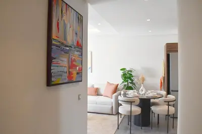 a living room with a table and a couch at Bright & Cozy Apt with City View in Casablanca