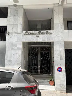 a car parked in front of a building at Charming Apartment With City View in Casablanca