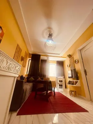 a living room with a couch and a table at Sduisant Studio in Casablanca in Casablanca