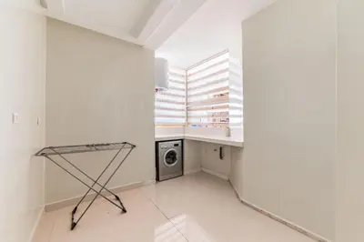 a laundry room with a washing machine and a window at L'Eden - 2 BR - Beachfront & Pool - 3 beds in Tamaris