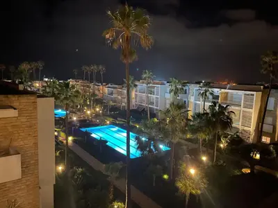 an aerial view of a hotel at night at L'Eden - 2 BR - Beachfront & Pool - 3 beds in Tamaris