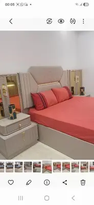 a bedroom with a bed with red pillows at Villa au centre ville Rabat in Rabat