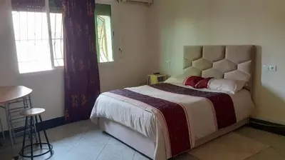 a bedroom with a large bed in a room at Le Grand Refuge des Lilas in Casablanca
