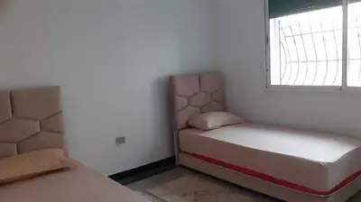 a small room with a bed and a window at Le Grand Refuge des Lilas in Casablanca