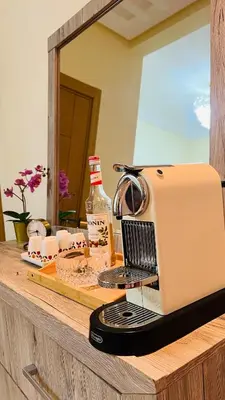 a sewing machine sitting on a counter with a mirror at CASABAY KETTANI SIDI Rahal in Sidi Rahal