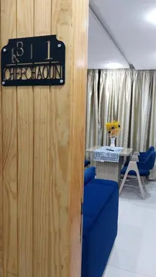 a sign on a wall in a room with a table at Studio Chefchaoun in Deroua