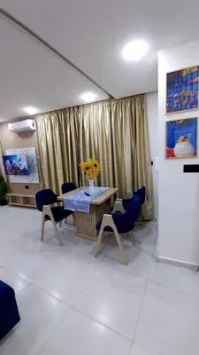 a room with a table and some chairs and a table and a table and chairs at Studio Chefchaoun in Deroua