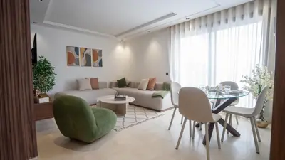 a living room with a couch and a table at City Chic stade&centre Princesse in Casablanca