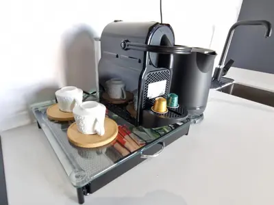 a coffee maker on a tray with dishes and cups at City Chic stade&centre Princesse in Casablanca