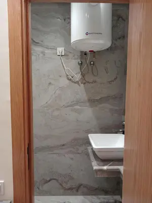 a stone bathroom with a sink and a toilet at Cosy Studio Sea View in Casablanca in Tamaris