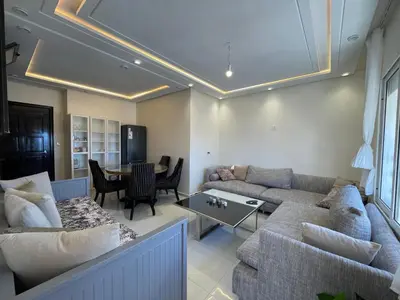 a living room with a couch and a table at Cosy Studio Sea View in Casablanca in Tamaris