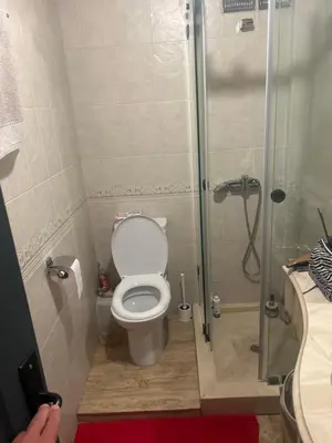 a bathroom with a toilet and a glass shower at twins in Casablanca