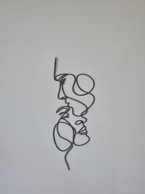 a black and white drawing of a face at Seaside Artist's Villa in Temara