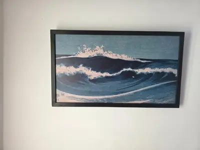 a painting of a wave on a wall at Seaside Artist's Villa in Temara
