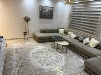 a living room with a couch and a table at Chic house living in Casablanca