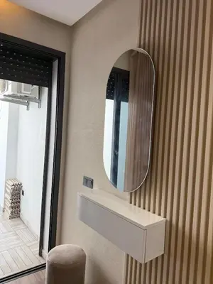 a bathroom with a sink and a mirror on the wall at Stylish Apartment with a seaview 9 in Casablanca