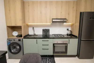 a kitchen with a stove and a refrigerator at Luxurious studio Great location in Casablanca