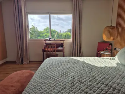 a bedroom with a bed and a desk and a window at Beach Villa with Private Pool, Ideal for Families in Casablanca