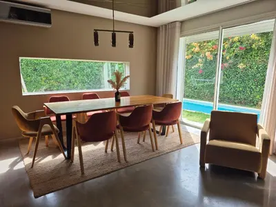 a dining room with a wooden table and chairs at Beach Villa with Private Pool, Ideal for Families in Casablanca