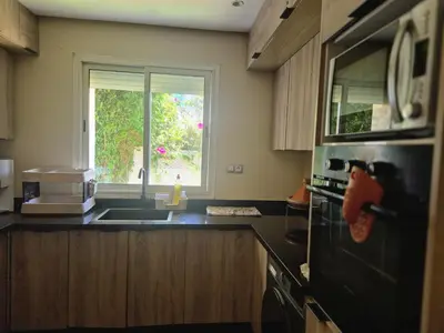 a kitchen with a sink and a window at Beach Villa with Private Pool, Ideal for Families in Casablanca
