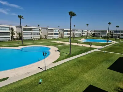an image of an apartment complex with two pools at Ola Blanca in Dar Hamida