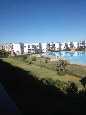 a view of a swimming pool in a building at Villa pied dans l'eau in Sidi Rahal