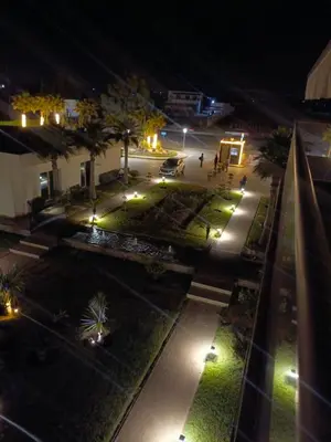 an aerial view of a courtyard at night with lights at Blue Beach sidi rahal in Sidi Rahal