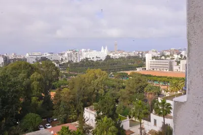 a view of a city with trees and buildings at Le 135 appart hotel in Casablanca