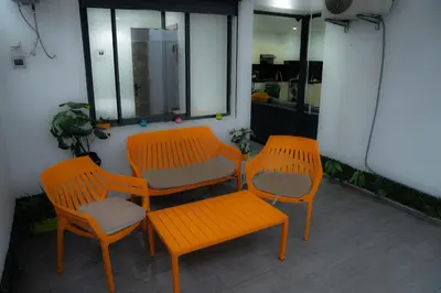 three orange chairs and a bench on a balcony at R102-3-4 Amazing apartments in Belvedere with Breathtaking Ocean and Street Views in Casablanca