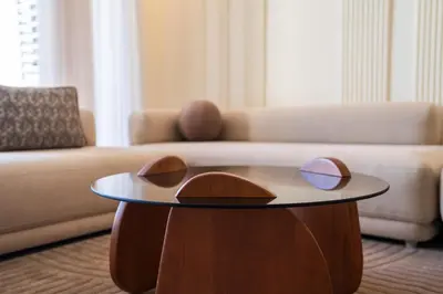 a living room with a coffee table in front of a couch at Le yacht apartment II Oceanfront residence 2 BR 2 BA in Casablanca