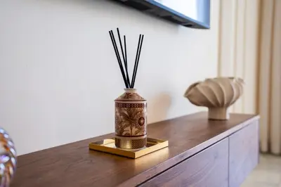a vase sitting on top of a wooden table at Le yacht apartment II Oceanfront residence 2 BR 2 BA in Casablanca