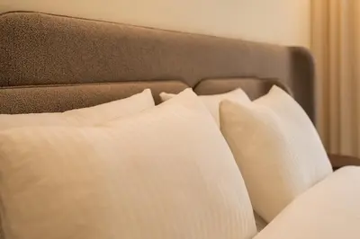 a group of pillows sitting on a bed at Le yacht apartment II Oceanfront residence 2 BR 2 BA in Casablanca