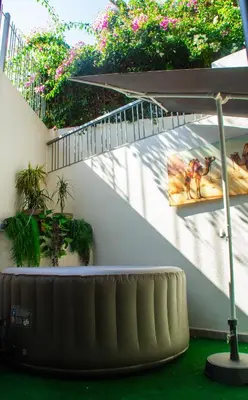 a spiral stairway with a horse picture on the wall at Private terrasse and spa Studio Sahara in Casablanca in Casablanca