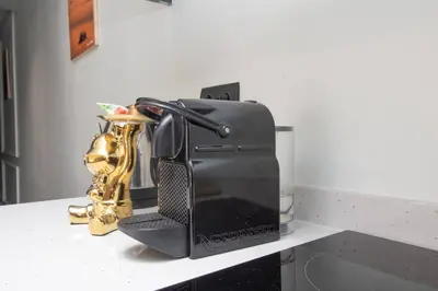 a black appliance sitting on a counter with a saxophone at Private terrasse and spa Studio Sahara in Casablanca in Casablanca