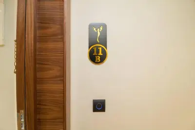 a door with a clock on the side of it at Private terrasse and spa Studio Sahara in Casablanca in Casablanca