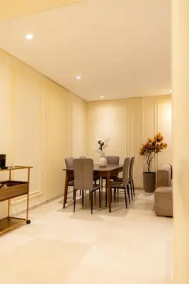 a dining room with a table and chairs at Luxury 2 BR 2 BA Alsace Lorraine downtown in Casablanca