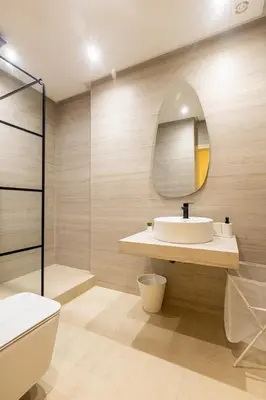 a bathroom with a sink and a mirror at Luxury 2 BR 2 BA Alsace Lorraine downtown in Casablanca