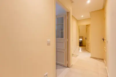 a hallway with a door leading into a room at Luxury 2 BR 2 BA Alsace Lorraine downtown in Casablanca