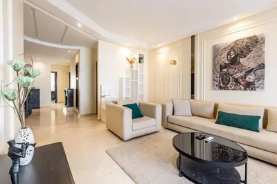 a living room with a couch and a table at cozy living, Chic 3BR appartement with parking! in Casablanca
