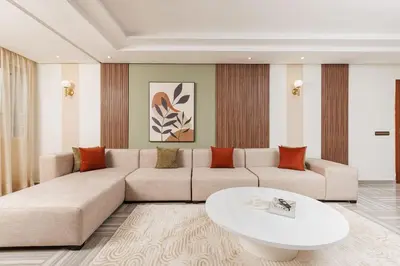a living room with a couch and a table at 3BR Modern Stay in Heart of Rabat in Rabat