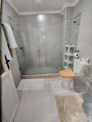 a bathroom with a shower and a toilet at Spacious with Great Location in Casablanca