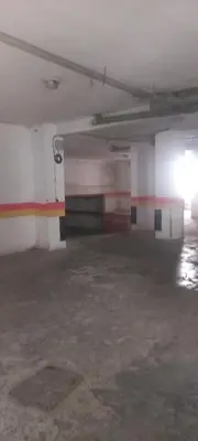 an empty parking garage with a room with colorful walls at Vue Mer & Sérénité, Appartement Chic avec Piscine à Dar Bouazza in Tamaris