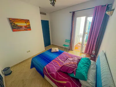 a bedroom with a bed and a window at DarBouazza SurfHouse Sea View in Tamaris